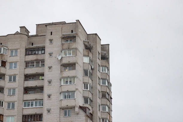 istock Tall houses against on a gray sky background 1300263146