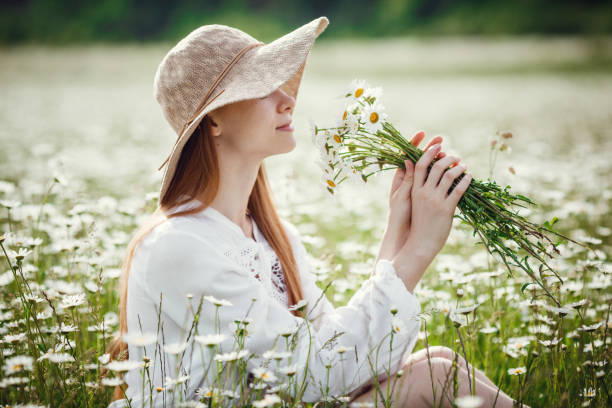 istock Young red-haired traveler in fairy-tale beautiful scenery. 1300266377