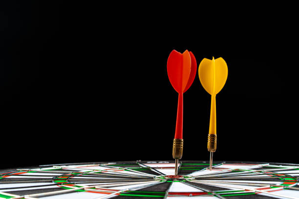 istock Dartboard on black dark background close up 1300266441