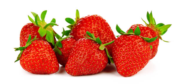 istock Group of strawberries with leaves isolated on a white background. 1300266466