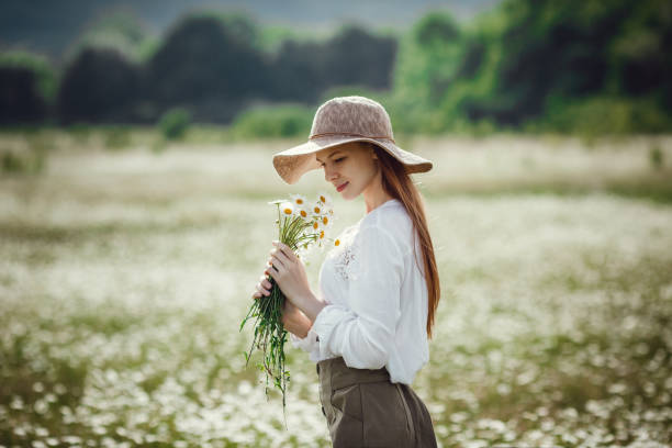 istock Young red-haired traveler in fairy-tale beautiful scenery. 1300267199