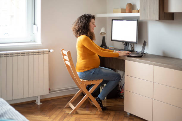 istock Pregnant woman working from home 1300267277