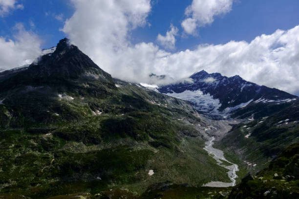 istock huge glacier with a mountains creek in the mountains 1300267290
