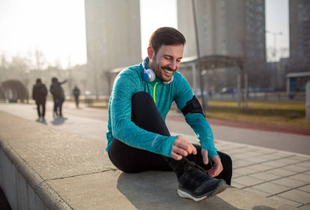 istock Runner trying running shoes getting ready for run 1300267447