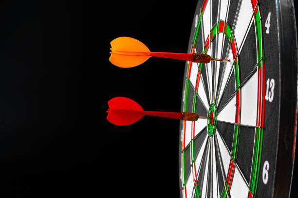 istock Dartboard on black dark background close up 1300267564