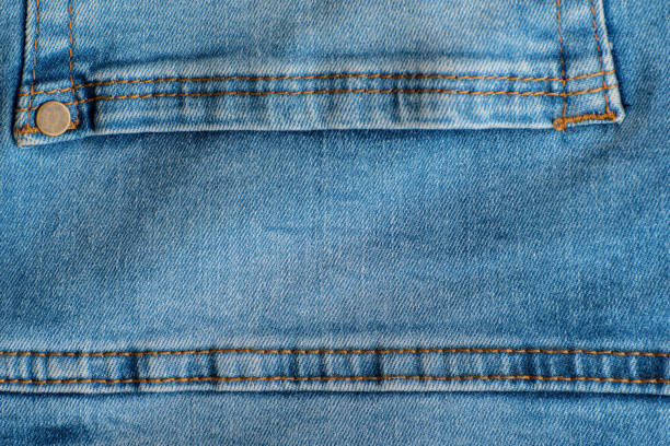 istock Jeans back pocket close up. Denim blue. Stitching on jeans. Rivets 1300267777