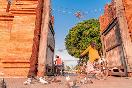 Chiang Mai / Thailand - February 20, 2019 : Tourists can rent bikes provided by Chiang Mai municipality at Thapae Gate to explore the city.