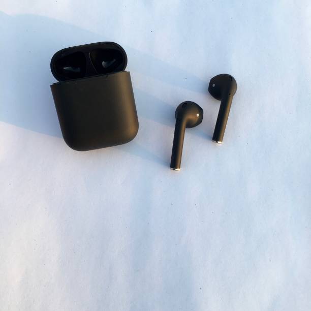 Black wireless AirPods on white background image