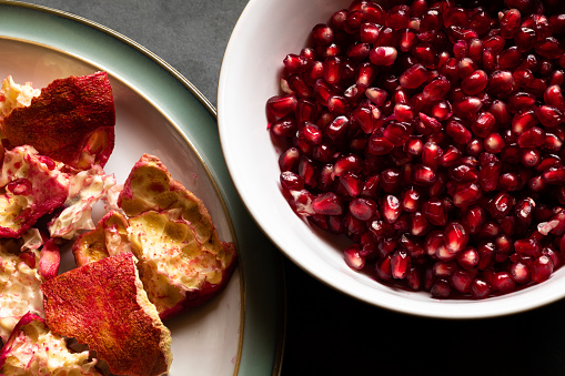 Pomegranate seeds and the peel from which they came just minutes before.