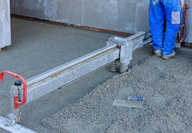 istock Employee performs sand and cement screed floor. Sand and cement floor screed 1300270085
