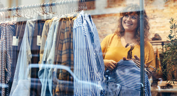 istock Woman working in a clothing store 1300272075