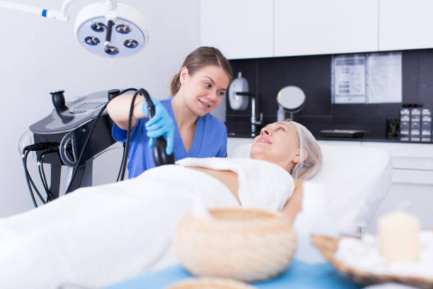 istock Cosmetician performing hardware body treatment 1300272286