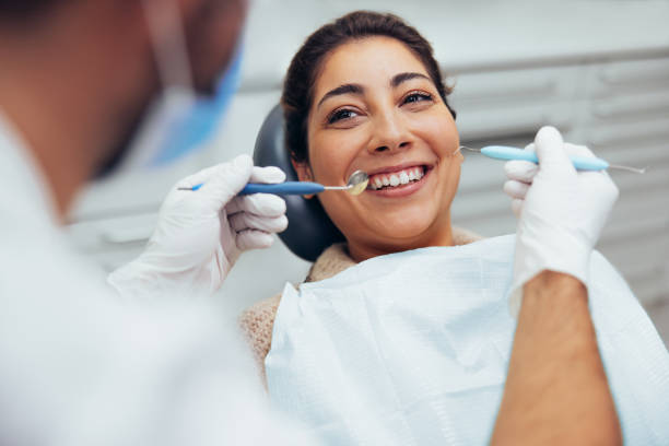 istock Woman having teeth examined at dentist 1300278103