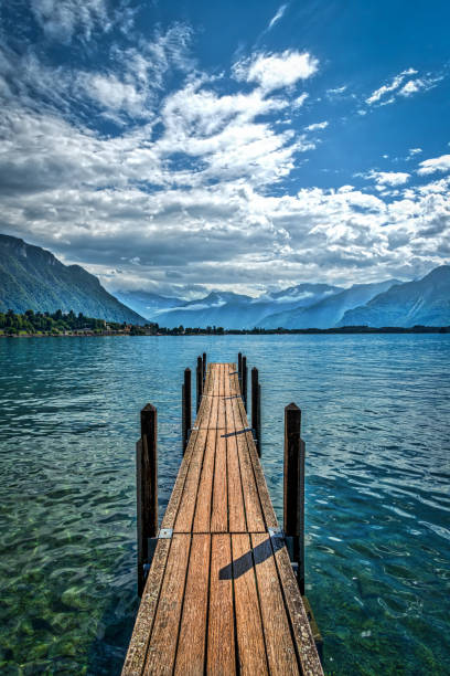 A jetty jutting out into the far end of Lake Geneva, Switzerland.