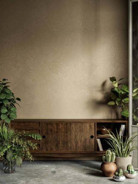 istock Beige interior with plants, dresser, stucco wall and decor. 1300279130