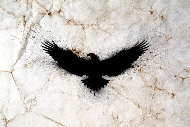 istock Black silhouette of a flying eagle with spread wings with paint splashes, splatters and blots on an old grunge vintage paper texture background. 1300280959