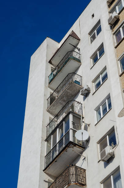 istock White building with balconies and air conditioning on a sunny day. 1300281763