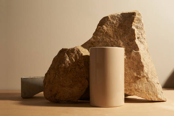 istock Stone and a piece of tile podium on a beige background 1300284963