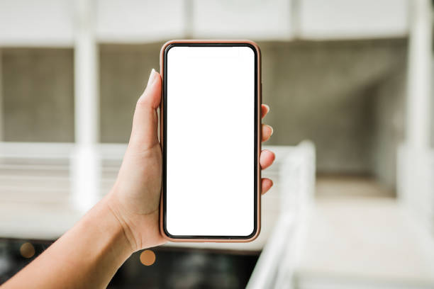 istock Women's hands holding cell telephone blank copy space screen. smart phone with technology concept 1300285612