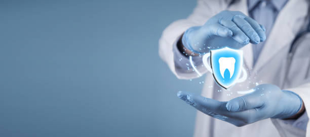 istock Caucasian dentist protect shield and tooth. Tooth protection 1300286147