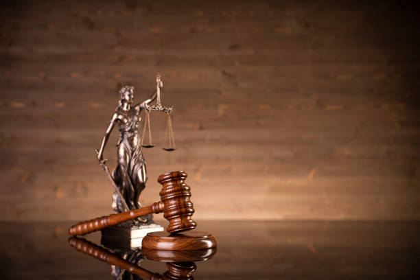 Law symbols composition. Gavel, scale, legal books and Themis sculpture  on brown background. Place for text. paragraph photos stock pictures, royalty-free photos & images