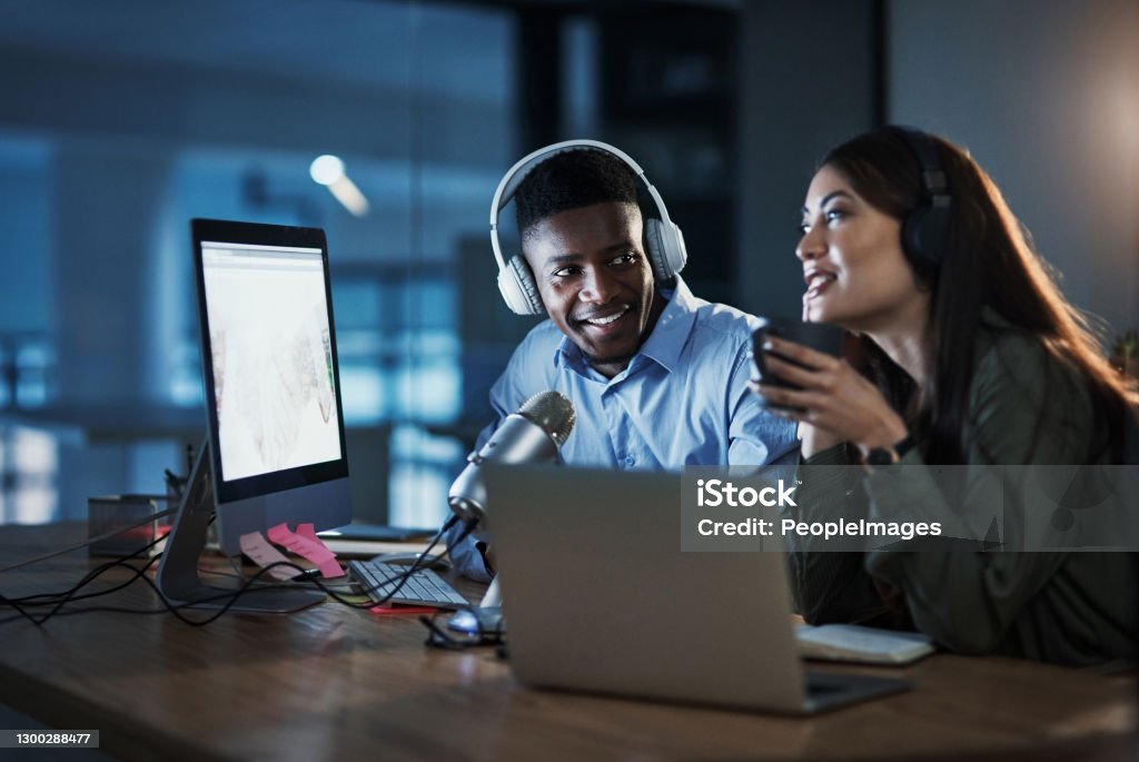 Don't forget to check out my other podcast interviews! Shot of two people doing a broadcast while sitting in an office at night Radio Broadcasting Stock Photo