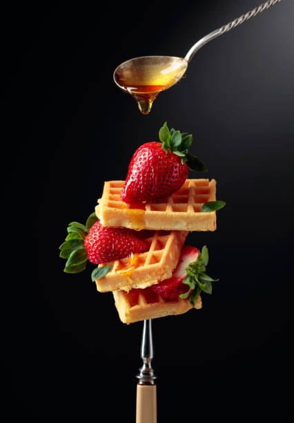 istock Waffles with strawberries and honey. 1300288699