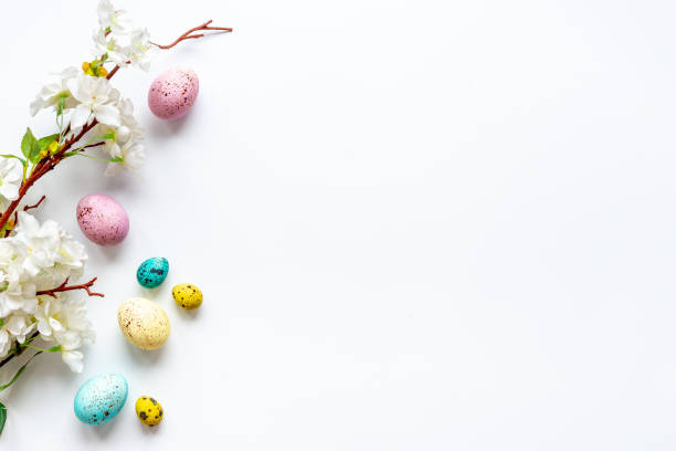 istock Happy Easter with eggs and flowering branch, top view 1300289825