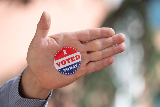 istock I voted stickers on human hand 1300292334