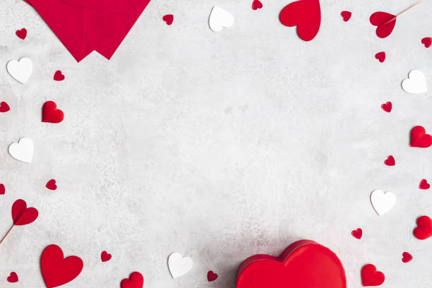 istock Valentine's Day background. Gift, envelope, hearts on concrete gray background. Valentines day concept. Flat lay, top view 1300292673