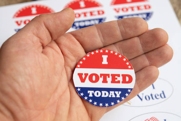 istock I voted stickers on human hand 1300292778