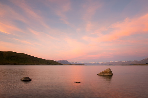 A glorious sunsets lights up the landscape around Lake Tekapo, on New Zealand's South Island.