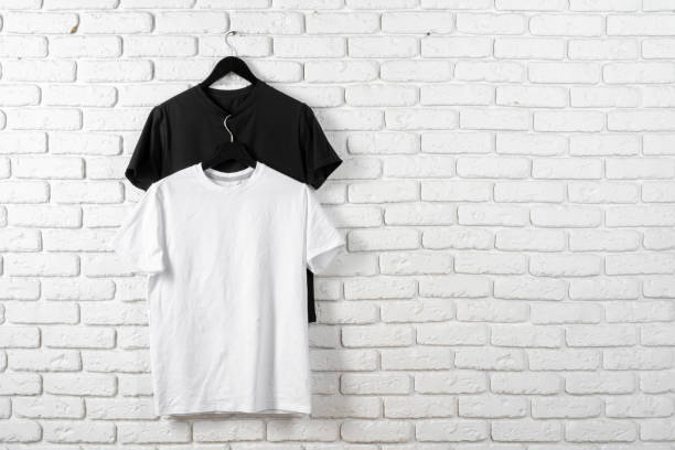 istock Black and white color two plain t-shirts 1300298863