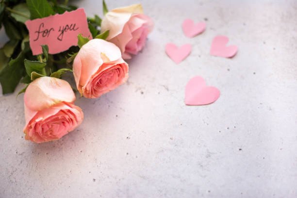 Valentine's Day theme frame: rose flowers and heart shaped decorations
