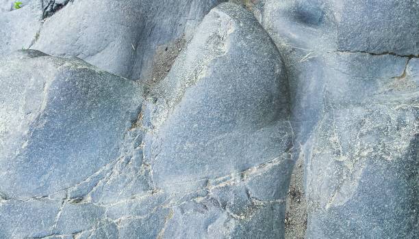 istock Ball shaped rock stone looks like waves in full frame view for grey backgrounds 1300300403