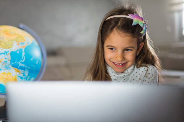 istock Beautiful girl homeschooling 1300302188