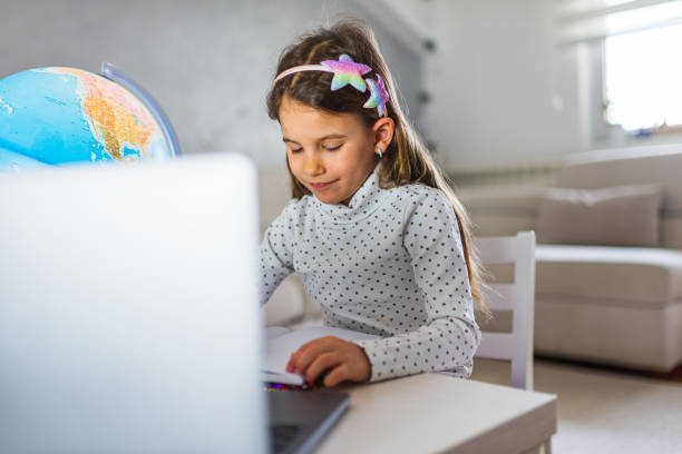 istock Beautiful girl homeschooling 1300303709