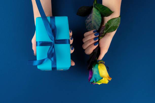 istock Fresh flowers and gift box with ribbon 1300303749