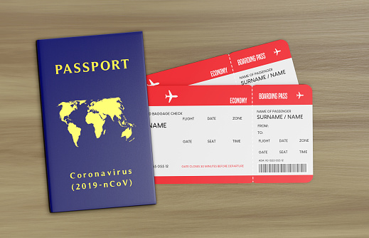 2 tickets are between the covid-19 passport. Global coronavirus and travel concept.