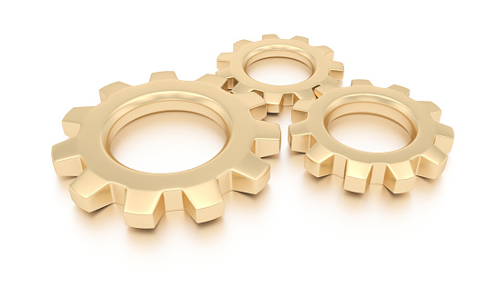 Gold gears isolated on white background