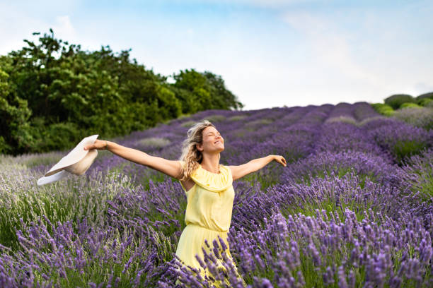 istock Woman enjoying on lavender field 1300310054