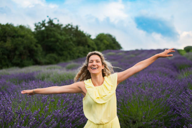 istock Woman enjoying on lavender field 1300310084