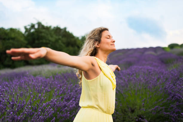 istock Woman enjoying on lavender field 1300310160