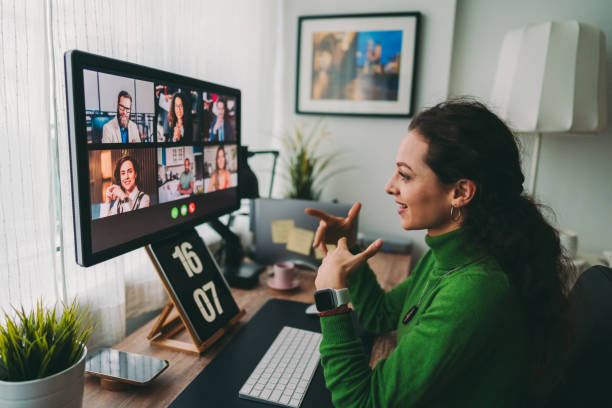 Business meeting on video call during COVID-19 lockdown Businesspeople discussing business on virtual staff meeting during pandemic lockdown viewpoint photos stock pictures, royalty-free photos & images