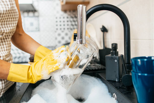 istock Housewife dish washing 1300313593