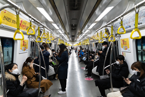 Seoul, Korea - January 21,2021: Inside the subway with people leaving work in the evening