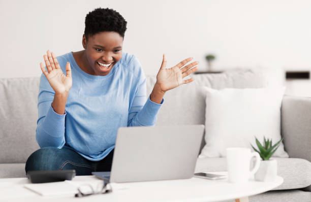 istock Black woman having video call using laptop and talking 1300315190