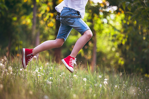 Happy child enjoying the good weather. Summer, spring.