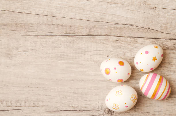 istock Colorful perfect handmade painted easter eggs on a wood background. 1300319308