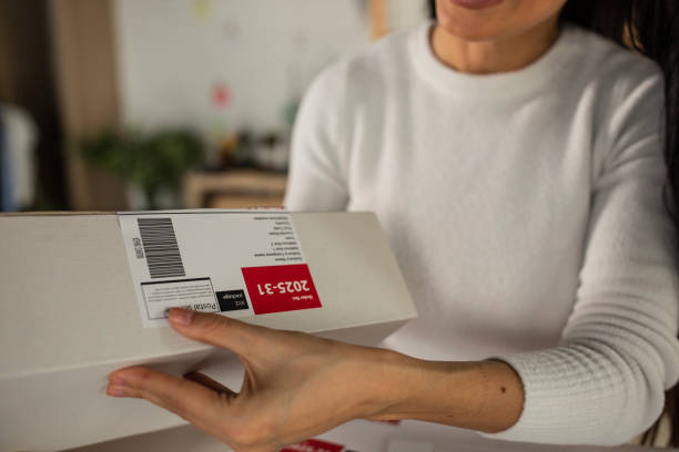 istock Making sure the label is perfectly applied on a package 1300320447